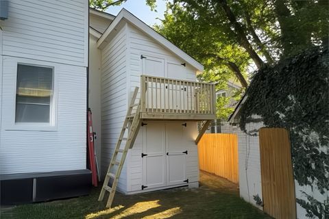 Two-story double-decker custom shed with Hardie siding