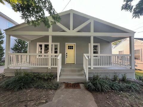Painted porch awning matched to the home's siding and trim